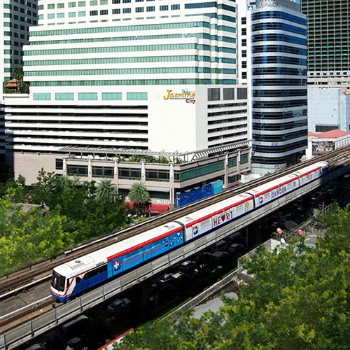 Jasmine City building with a BTS train