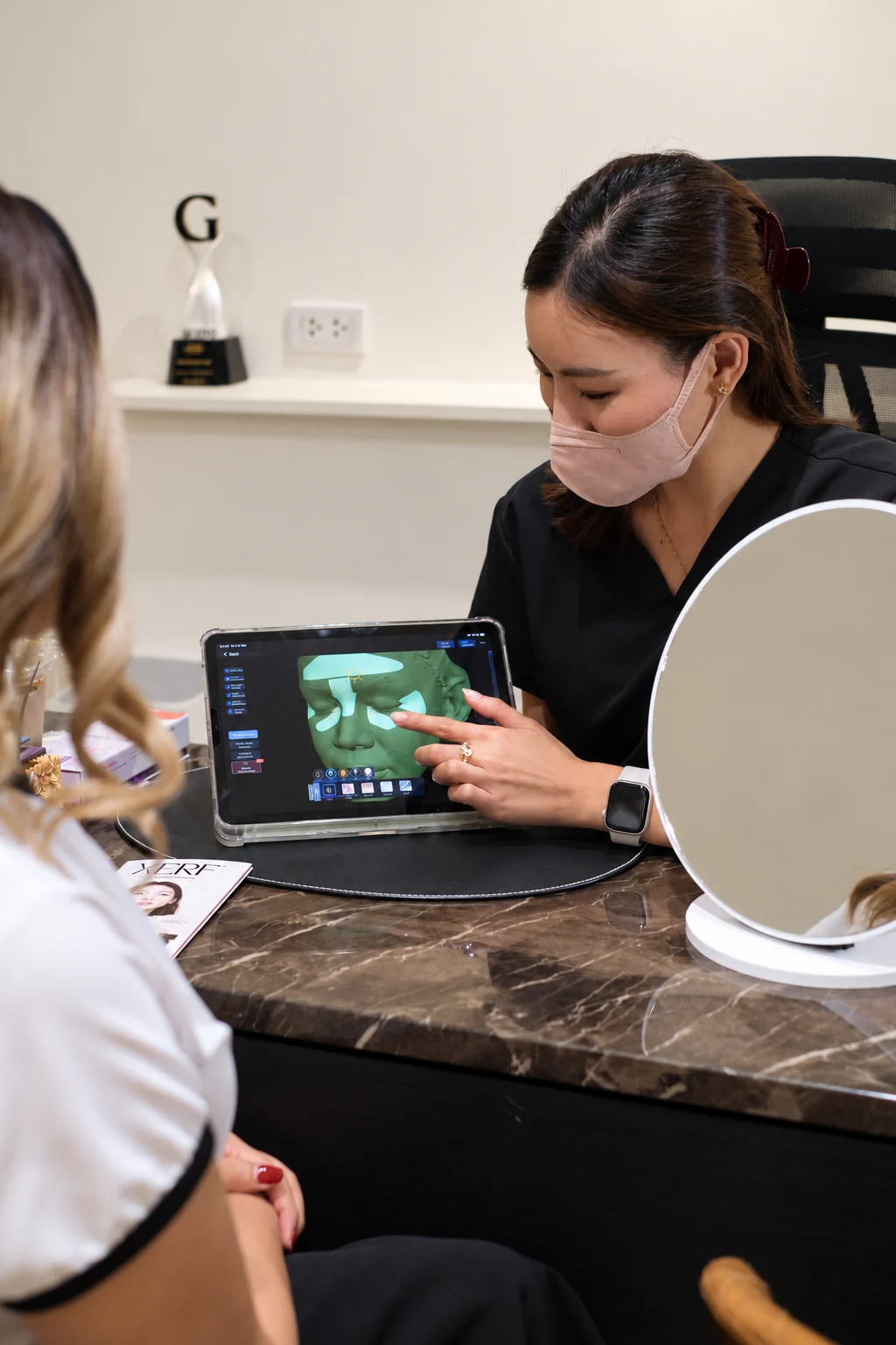 A doctor and client at BEHAP reviewing scan images on a screen together