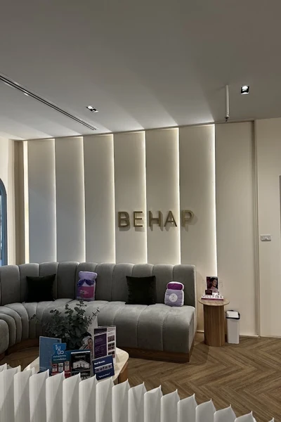 Clinic lounge seating beneath a BEHAP wall sign.