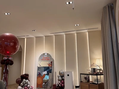 Clinic interior with a decorated mirror and balloons, photographed by Safe P.