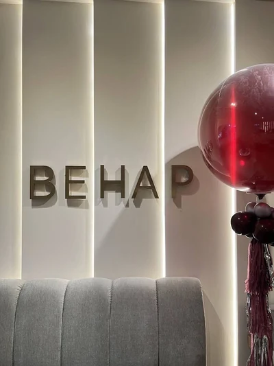 BEHAP wall sign above a sofa, photographed by Vasin S.