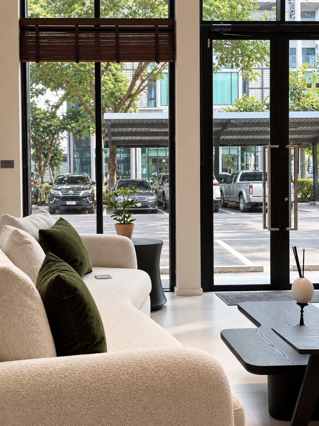 Light upholstered seating beside the glass clinic entrance and street-facing windows